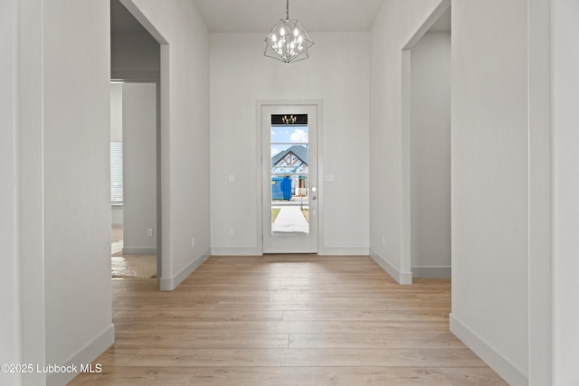 4614 138th Pl, Lubbock, TX 79424 - entryway with a chandelier and light wood-style flooring