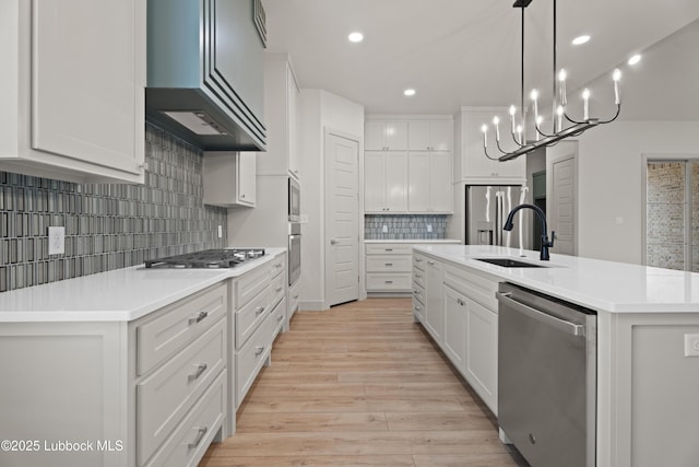 4614 138th Pl, Lubbock, TX 79424 - kitchen with appliances with stainless steel finishes, backsplash, light countertops, light wood-style floors, and white cabinets
