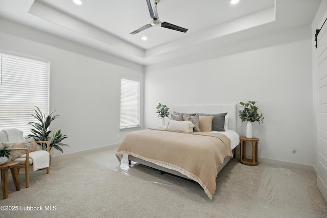 4614 138th Pl, Lubbock, TX 79424 - bedroom featuring a tray ceiling, light colored carpet, recessed lighting, and a ceiling fan