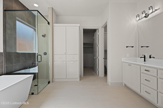 4614 138th Pl, Lubbock, TX 79424 - full bathroom with a soaking tub, a stall shower, and vanity