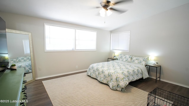 2007 68th St, Lubbock, TX 79412 - bedroom featuring dark wood-type flooring, lofted ceiling, baseboards, and a ceiling fan