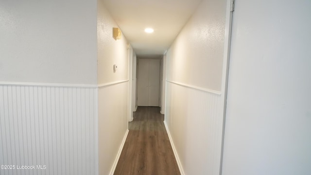 2007 68th St, Lubbock, TX 79412 - corridor featuring wood finished floors and a wainscoted wall