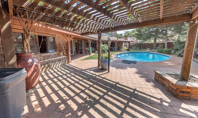 view of swimming pool with a patio area and a pergola