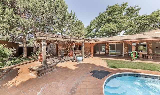 rear view of property with a patio and a pergola