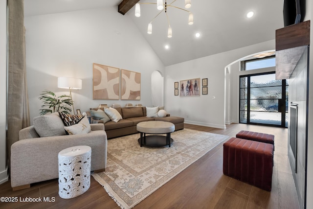 4606 138th Pl, Lubbock, TX 79424 - living area featuring arched walkways, high vaulted ceiling, beamed ceiling, wood finished floors, and recessed lighting