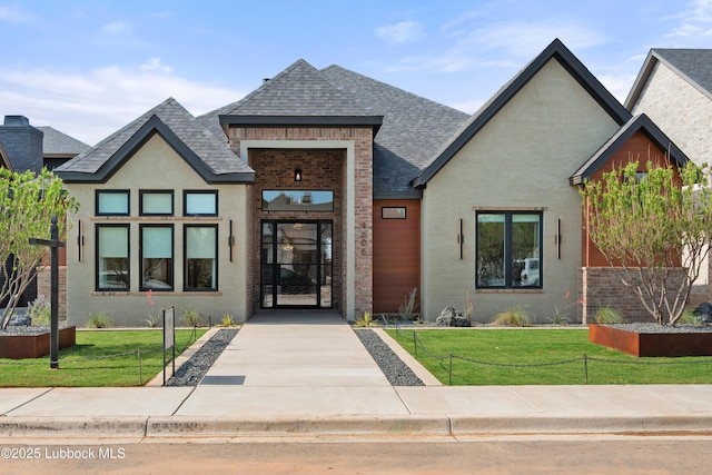 4606 138th Pl, Lubbock, TX 79424 - view of front facade featuring a shingled roof, a front lawn, and brick siding