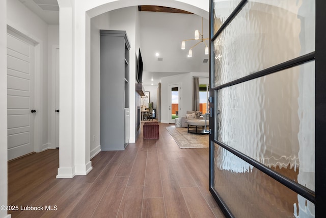 4606 138th Pl, Lubbock, TX 79424 - hallway featuring wood finished floors and arched walkways