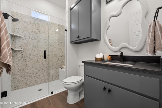 4606 138th Pl, Lubbock, TX 79424 - full bathroom featuring vanity, a shower stall, and wood finished floors