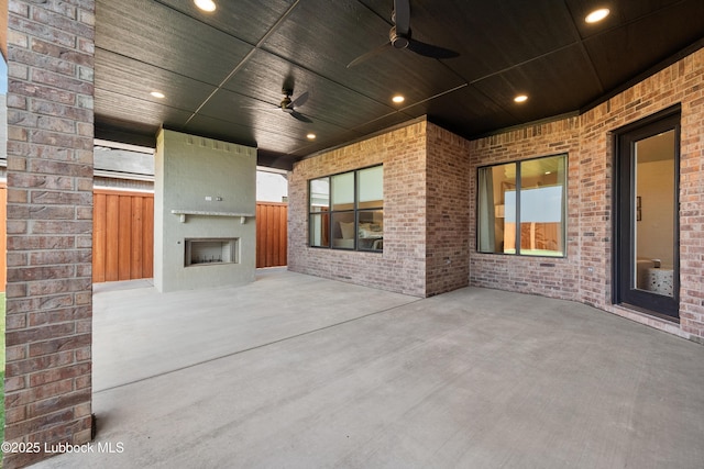 4606 138th Pl, Lubbock, TX 79424 - view of patio / terrace with a large fireplace and ceiling fan