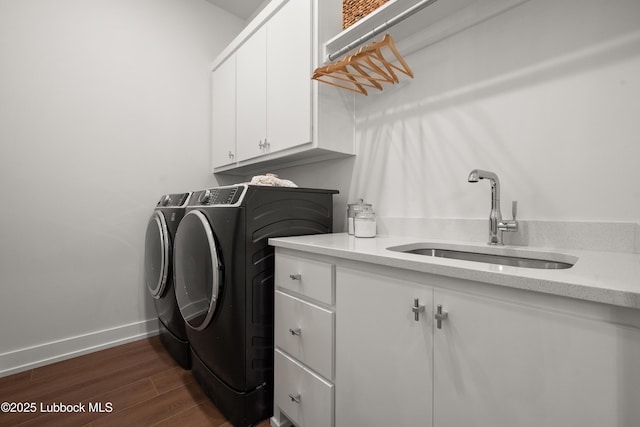 4606 138th Pl, Lubbock, TX 79424 - washroom featuring cabinet space, separate washer and dryer, and dark wood-style floors