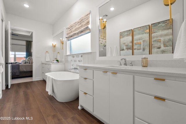 4606 138th Pl, Lubbock, TX 79424 - bathroom with plenty of natural light, a freestanding tub, vanity, and recessed lighting