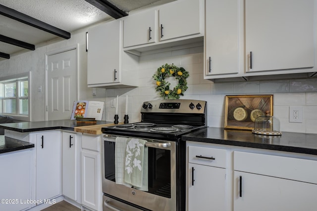 3819 30th St, Lubbock, TX 79410 - kitchen with stainless steel electric range oven, tasteful backsplash, and white cabinetry