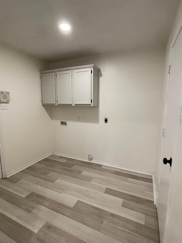 laundry room featuring hookup for a washing machine, baseboards, light wood-style floors, and hookup for an electric dryer