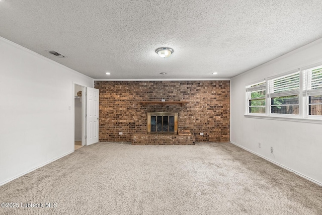 3415 39th St, Lubbock, TX 79413 - unfurnished living room featuring a brick fireplace, carpet, a textured ceiling, recessed lighting, and ornamental molding