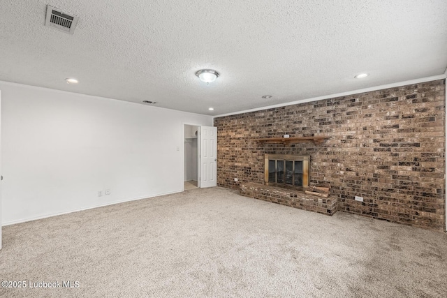 3415 39th St, Lubbock, TX 79413 - unfurnished living room featuring recessed lighting, a textured ceiling, carpet flooring, and a fireplace
