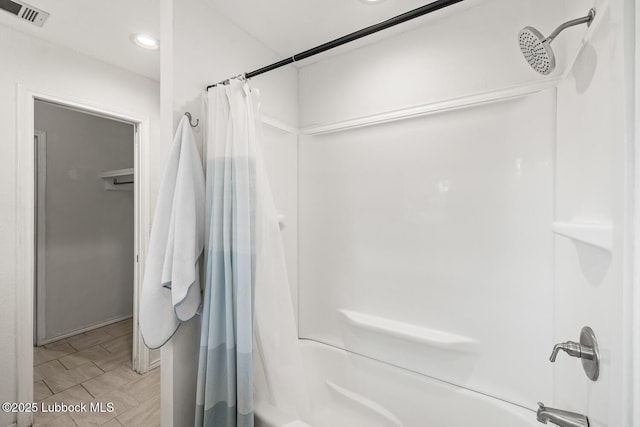 3415 39th St, Lubbock, TX 79413 - bathroom featuring shower / bath combination with curtain and recessed lighting