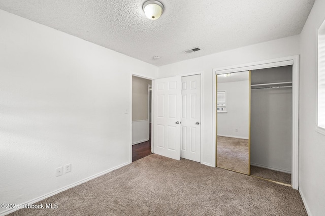 3415 39th St, Lubbock, TX 79413 - unfurnished bedroom with carpet and a textured ceiling