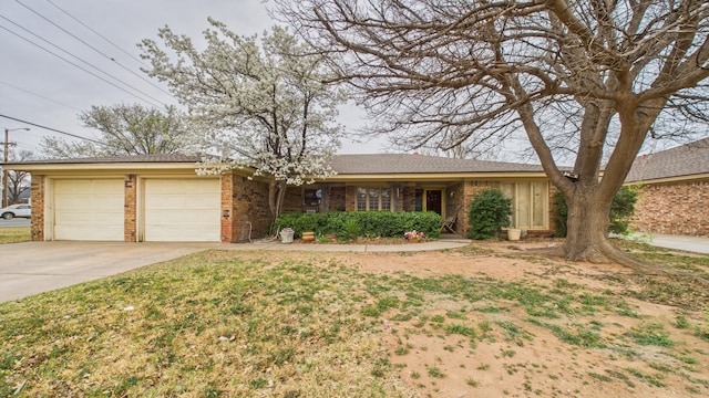 ranch-style house featuring driveway, brick siding, and a garage