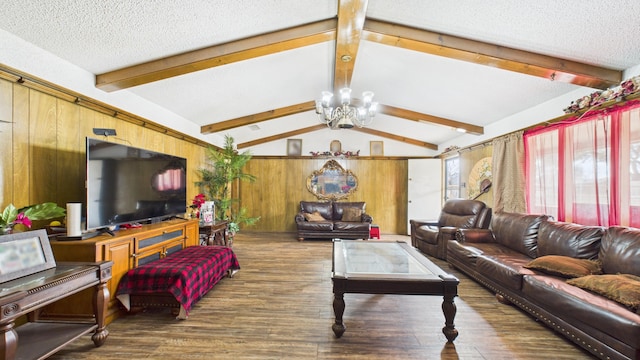 living room with wood finished floors, an inviting chandelier, vaulted ceiling with beams, a textured ceiling, and wooden walls