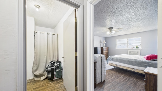 bedroom with wood finished floors, a ceiling fan, and a textured ceiling
