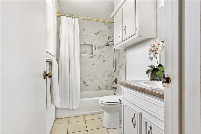 full bathroom with tile patterned flooring, vanity, shower / tub combo with curtain, and toilet