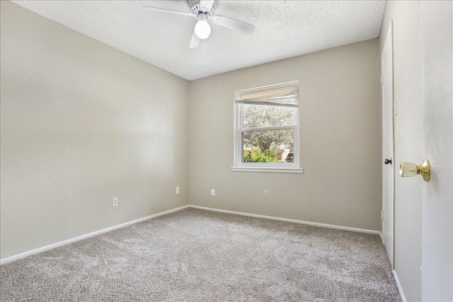 carpeted empty room with a textured ceiling and ceiling fan