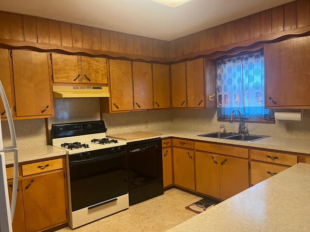 kitchen with sink, backsplash, range with gas stovetop, and dishwasher