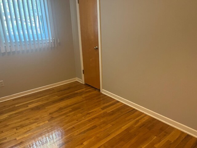 spare room featuring hardwood / wood-style floors