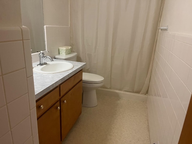 bathroom featuring vanity, tile walls, a shower with shower curtain, and toilet