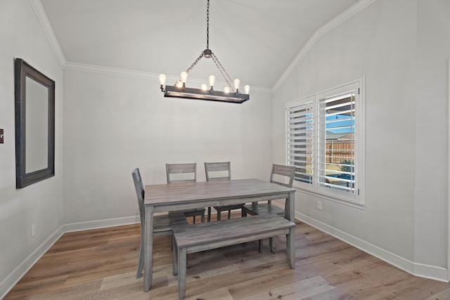 4014 126th St, Lubbock, TX 79423 - dining area with crown molding, lofted ceiling, a chandelier, wood finished floors, and baseboards