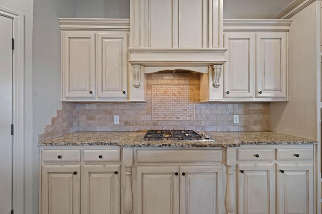 4014 126th St, Lubbock, TX 79423 - kitchen featuring backsplash, stainless steel gas stovetop, and light stone countertops