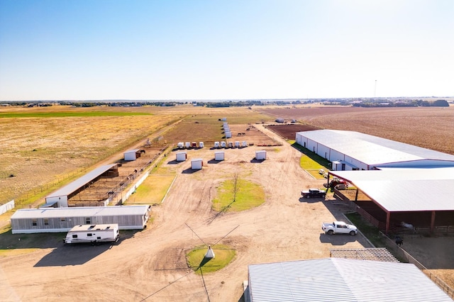 birds eye view of property with a rural view