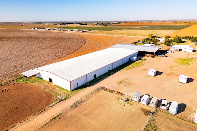 birds eye view of property with a rural view