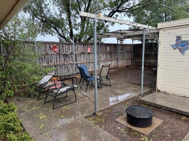 view of patio / terrace featuring an outdoor fire pit and a pergola