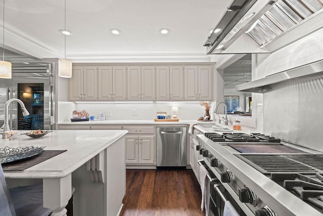 kitchen featuring crown molding, hanging light fixtures, stainless steel appliances, dark hardwood / wood-style floors, and custom exhaust hood