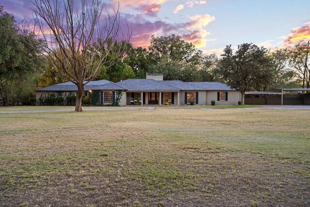 view of front of property with a lawn