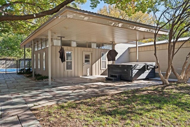 exterior space featuring a hot tub