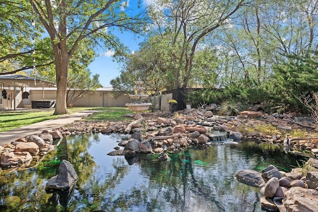 water view featuring a garden pond