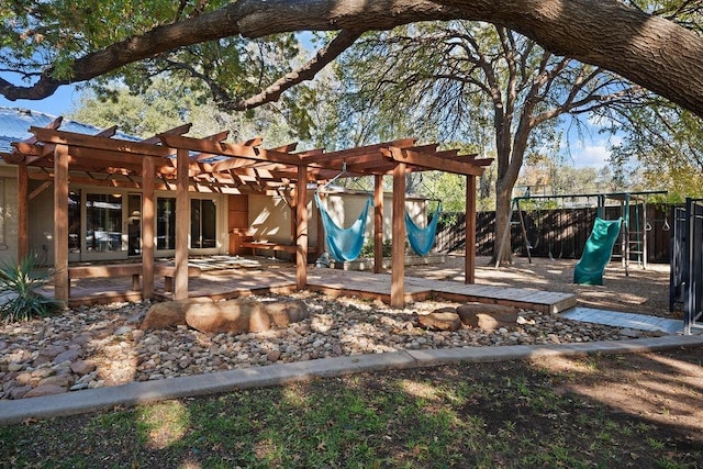 view of yard with a playground and a pergola