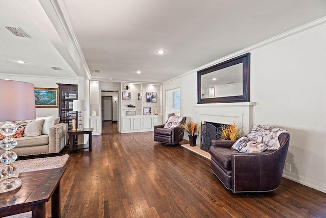 living room with crown molding and dark hardwood / wood-style floors