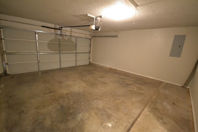 garage with a garage door opener and electric panel