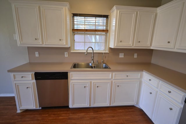 kitchen featuring sink, stainless steel dishwasher, white cabinets, and dark wood-type flooring