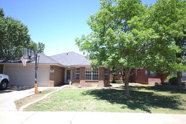 ranch-style home featuring a garage and a front yard