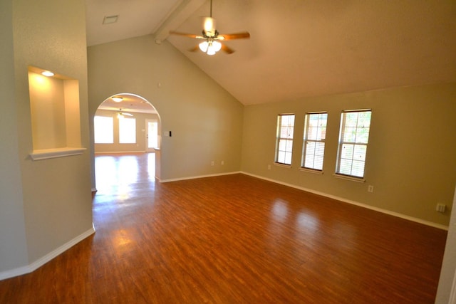 unfurnished living room featuring ceiling fan, dark hardwood / wood-style flooring, high vaulted ceiling, and beam ceiling