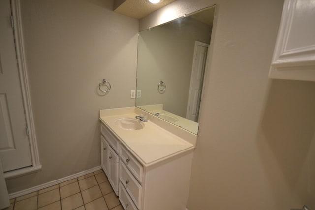 bathroom with vanity and tile patterned flooring