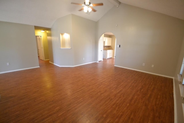 spare room featuring beamed ceiling, high vaulted ceiling, dark hardwood / wood-style floors, and ceiling fan