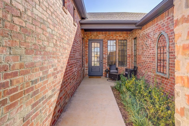 4309 136th St, Lubbock, TX 79423 - property entrance featuring brick siding and a shingled roof