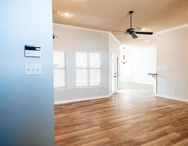 6916 Fulton Ave, Lubbock, TX 79424 - spare room with ceiling fan, ornamental molding, a textured ceiling, light wood-type flooring, and baseboards