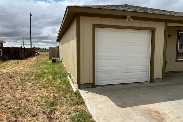 garage featuring a yard