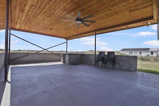 view of patio featuring ceiling fan